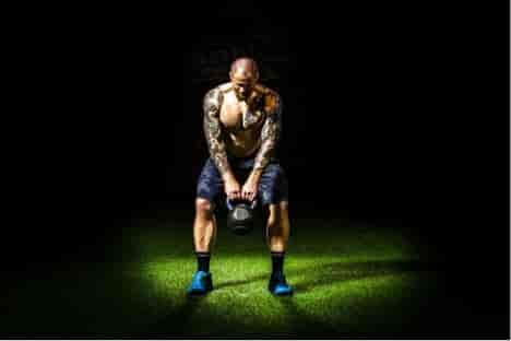 bodybuilder lifting kettlebell